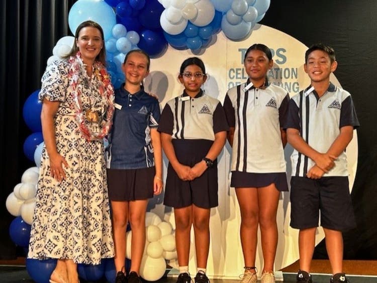 The Principal and the four student leaders at the celebration of learning assembly.