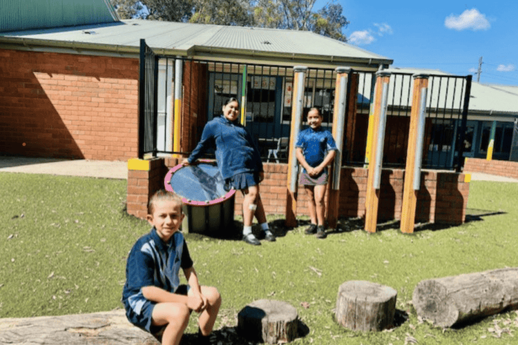 Three students in our inclusive learning playground.