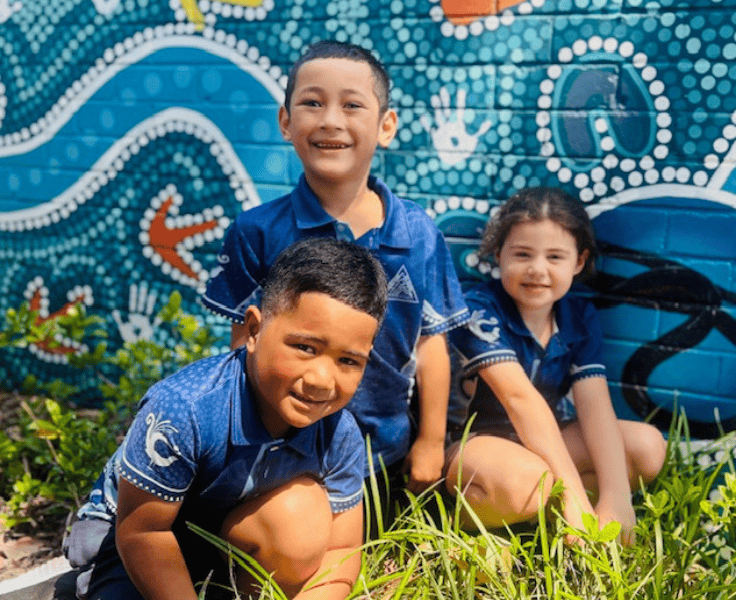 Three students in the garden.