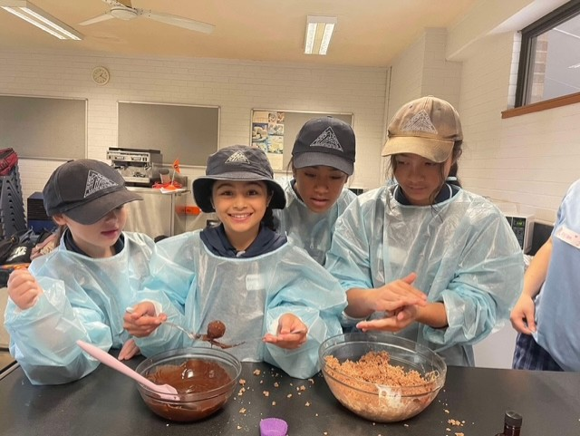 Students attending the high school - doing a science experiment in the science lab.